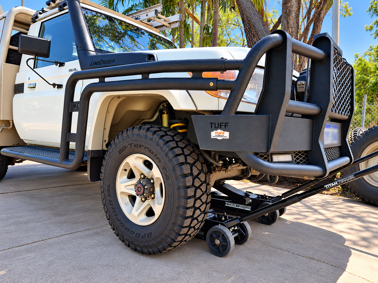 4WD LandCruiser raised on wheel skates during a tyre rotation